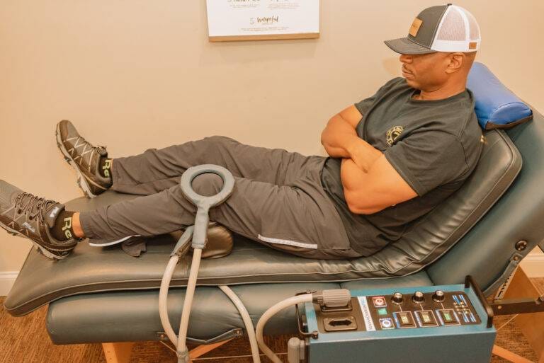 Man getting a pulsed electromagnetic field therapy treatment for knee pain relief