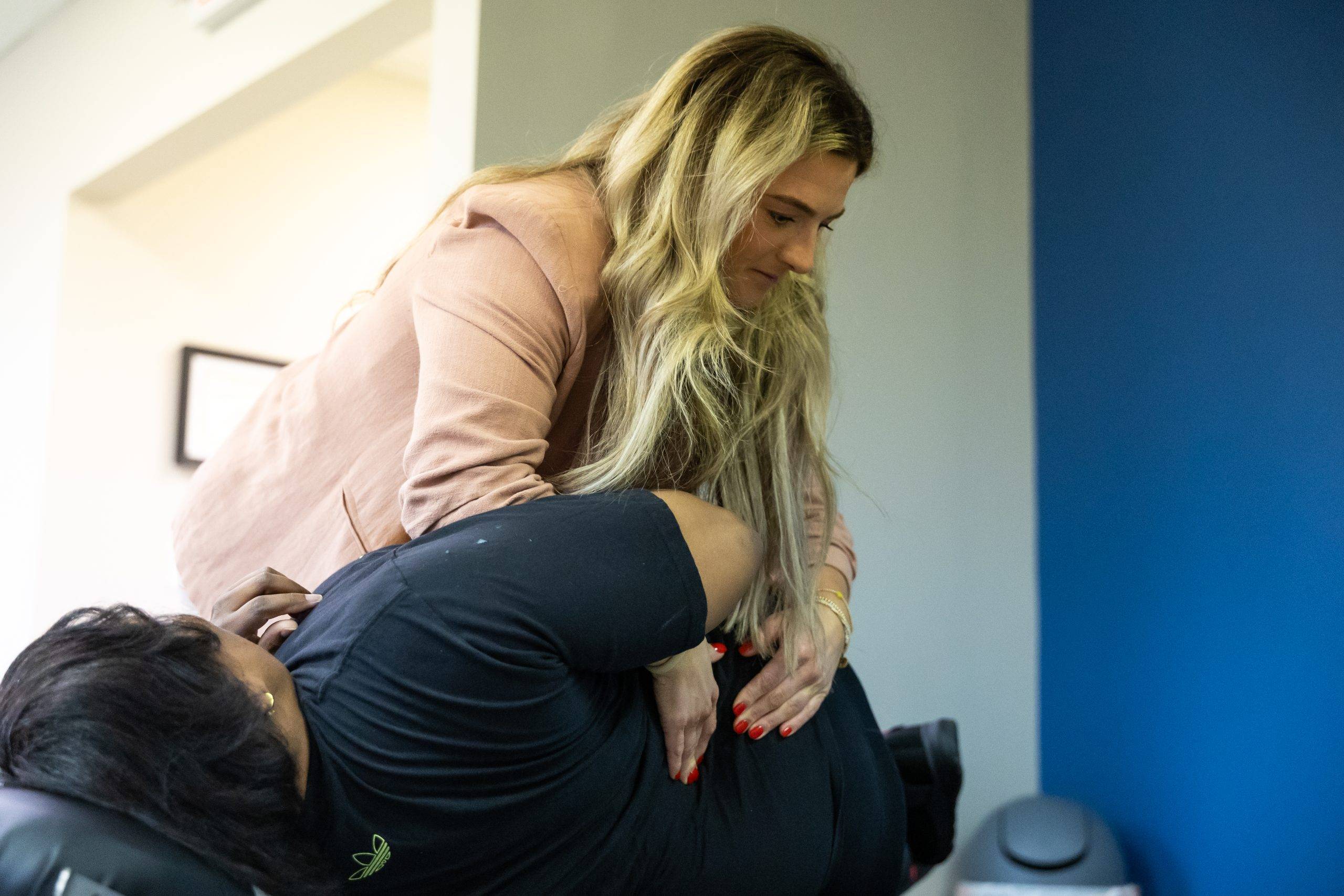 Chiropractic care manual adjustment on patient's back