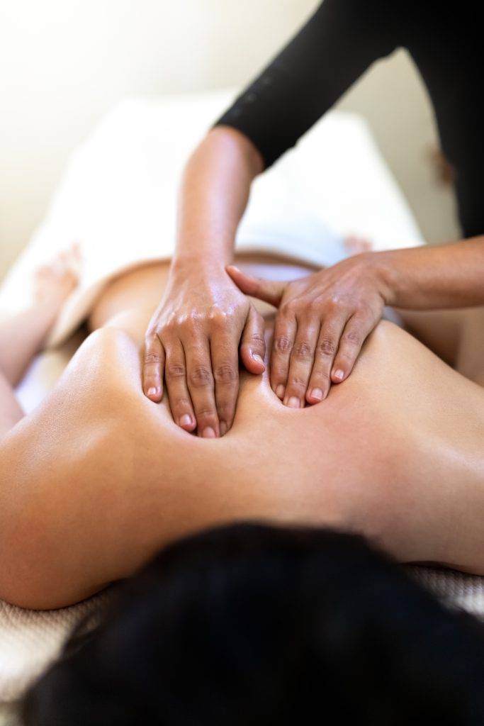 Patient getting a massage to reduce inflammation and back pain