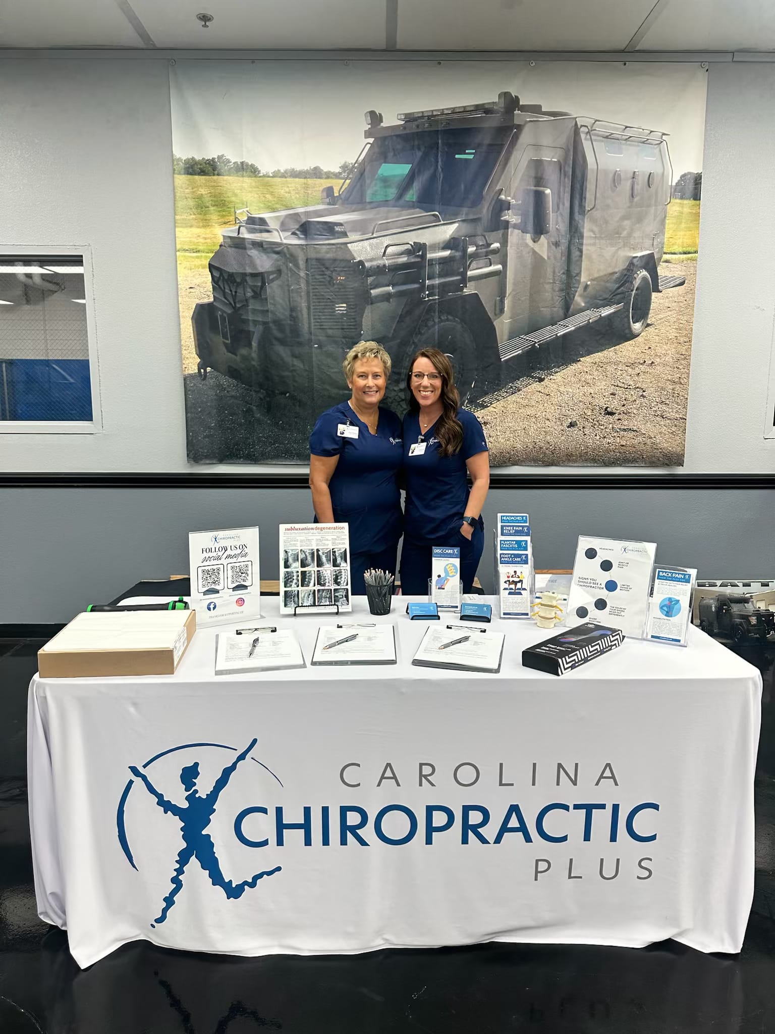 Team members at our display table at a health and wellness event